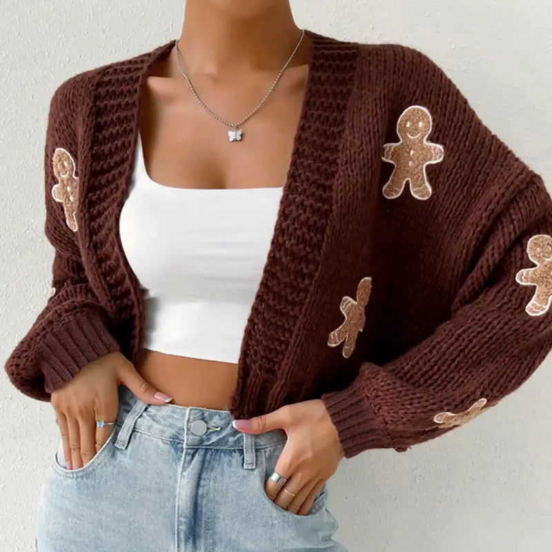 Green knitted cardigan with gingerbread appliqués — cozy holiday women’s sweater