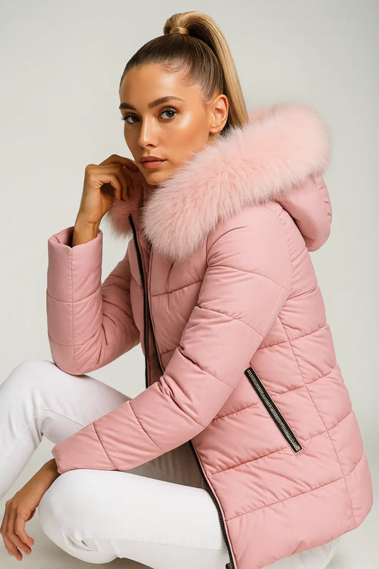 Women's pink puffer coat with faux fur hood and chic winter style
