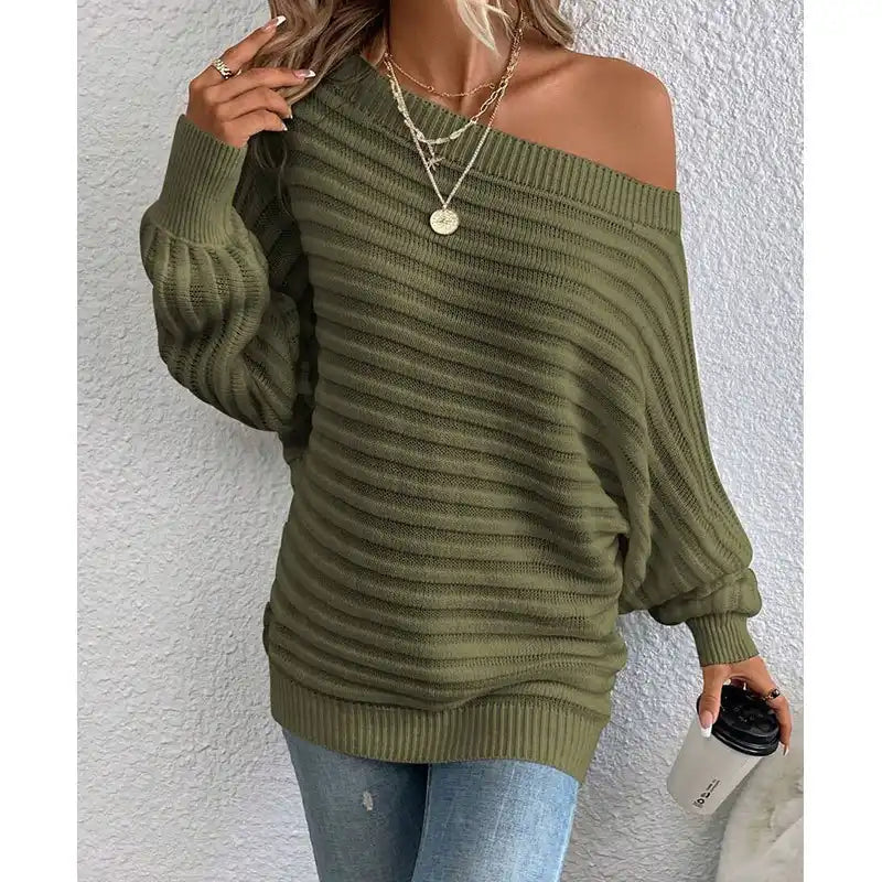 woman wearing a pink off-shoulder ribbed sweater styled with denim for a casual chic look